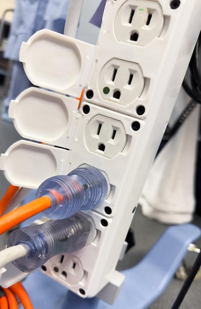 Closeup shot of an electric plug outlet installed in a white wall