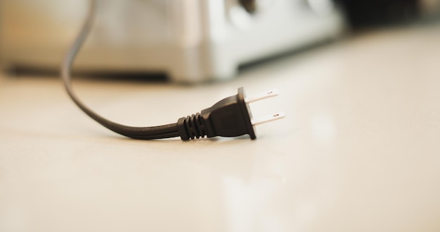 Closeup shot of an electric plug outlet installed in a white wall