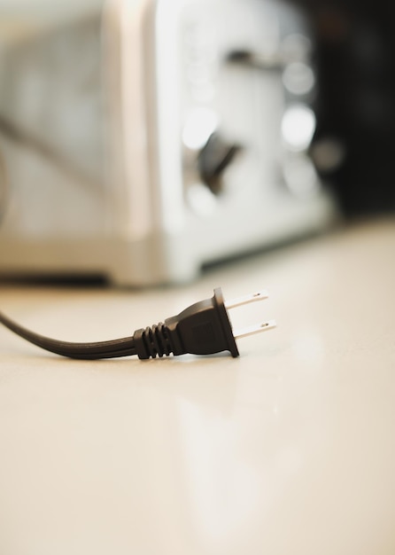 Closeup shot of an electric plug outlet installed in a white wall