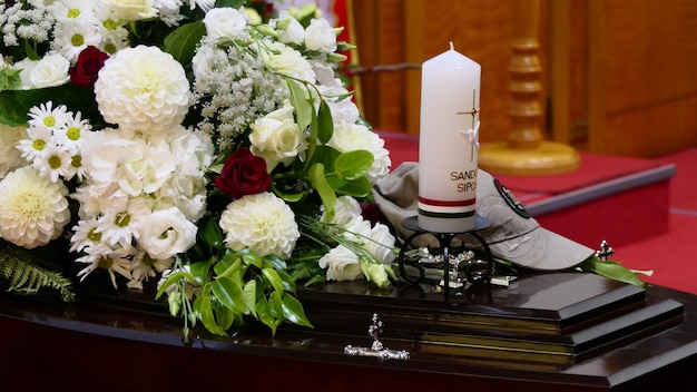 Photo closeup shot of a funeral casket or coffin in a hearse or chapel or burial at cemetery