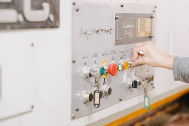 Closeup shot of a hand on control panel