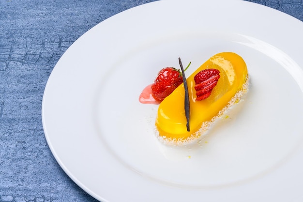 A closeup shot of a lemon cake with strawberries