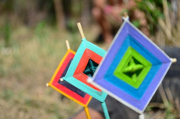 Closeup shot of Mandala God Eye Mexican crafts on a blurred background