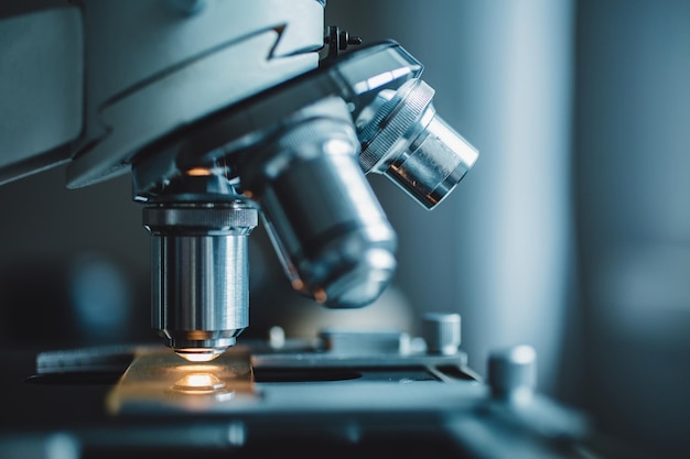 Closeup shot of microscope with metal lens at laboratory