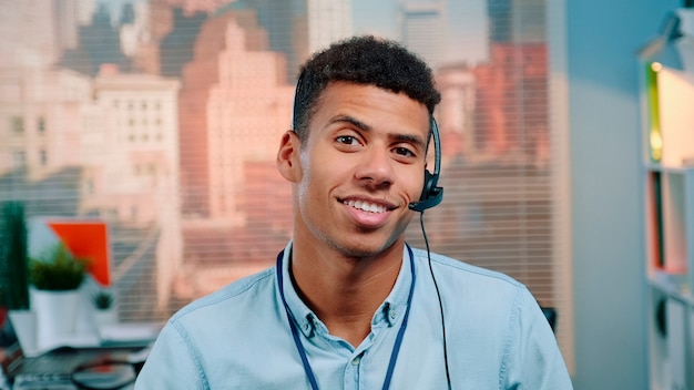 Closeup shot of mixedrace customer service operator talking to client in call center with skyscraper...