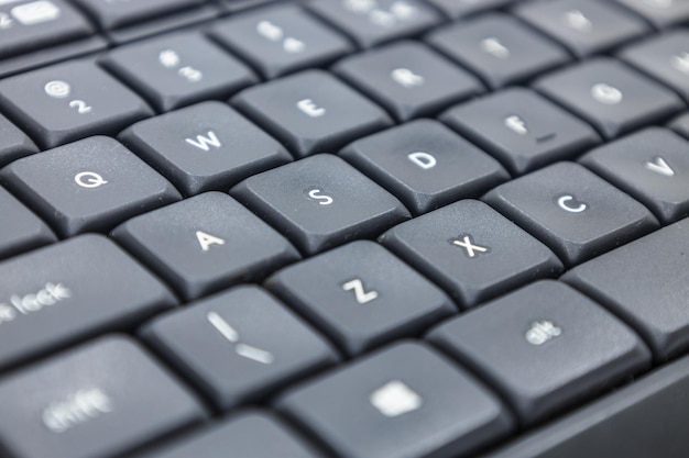 Photo closeup shot of a modern black computer keyboard