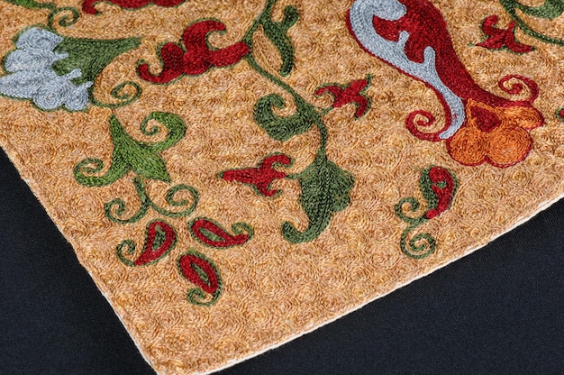 A closeup shot of national ornaments and patterns of Central Asia on a piece of fabric