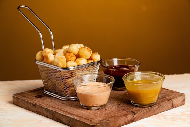 Photo a closeup shot of noisette potatoes with various sauces shot of