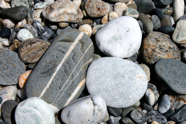 写真 ビーチの小石の石の背景のクローズアップショット