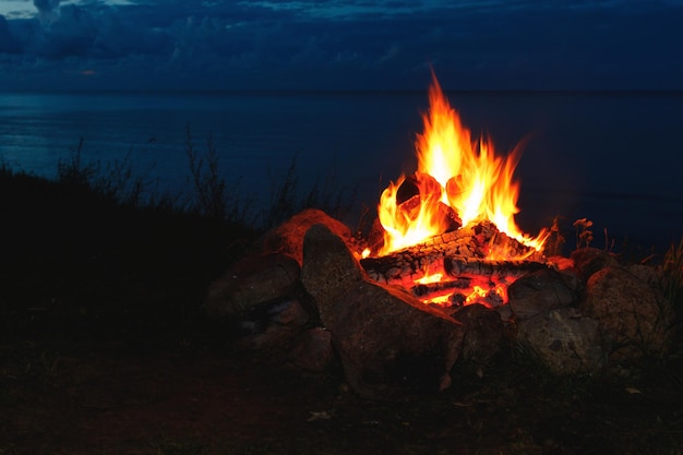 Closeup shot of outdoors campfire brightly burning at night