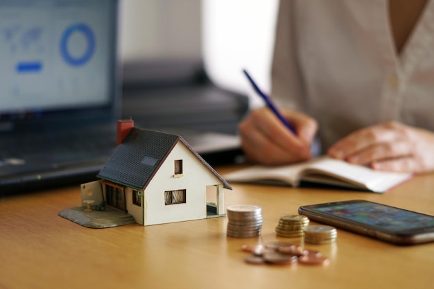 Closeup shot of a person thinking of buying or selling a house