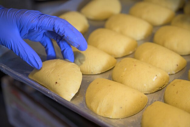 Closeup shot of the process of making appetizing empanadas, Venezuelan traditional cuisine