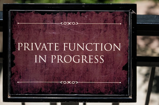 Photo closeup shot of a red private function in progress sign