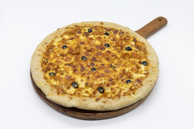 Closeup shot of a tasty pizza on a wooden board isolated on white background