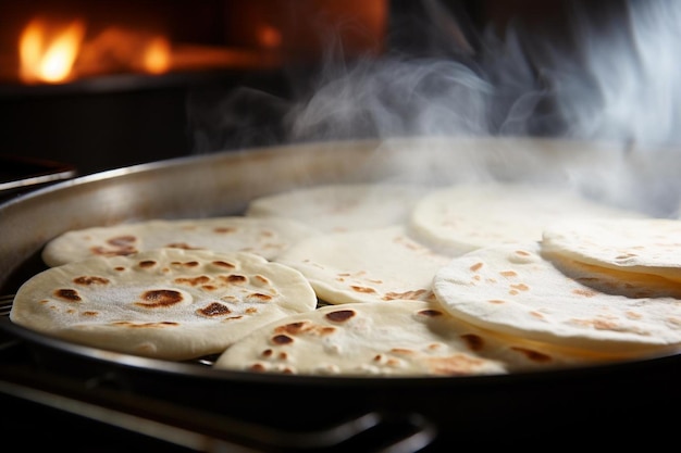 A closeup shot of tortillas being grilled before filli