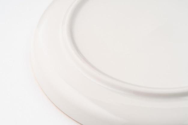 A closeup shot of the underside of a white plate