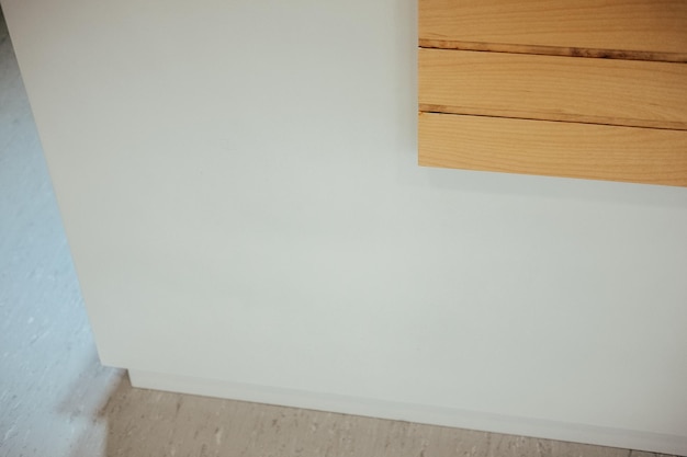 Closeup shot of a wall in the house with wooden details