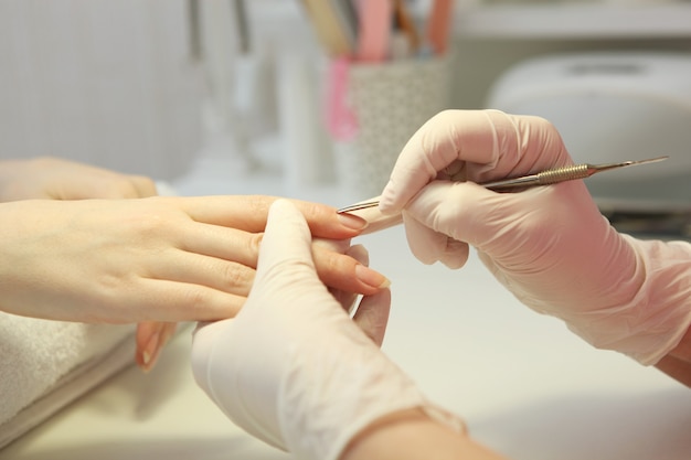 Closeup shot of a woman in a nail salon getting a manicure