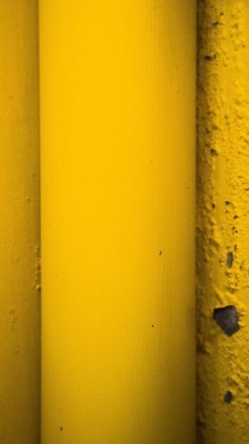 A closeup shot of a yellow pipe photo
