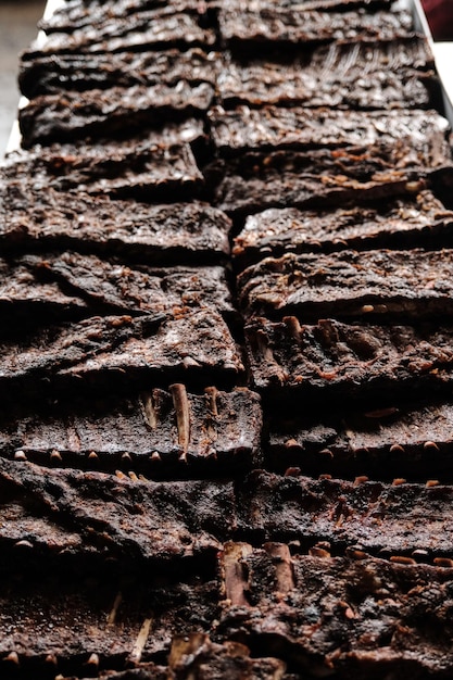 Photo closeup showcasing the texture and rich color of smoked ribs