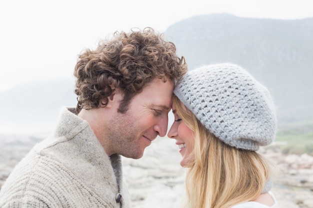 Closeup side view of a romantic young couple together