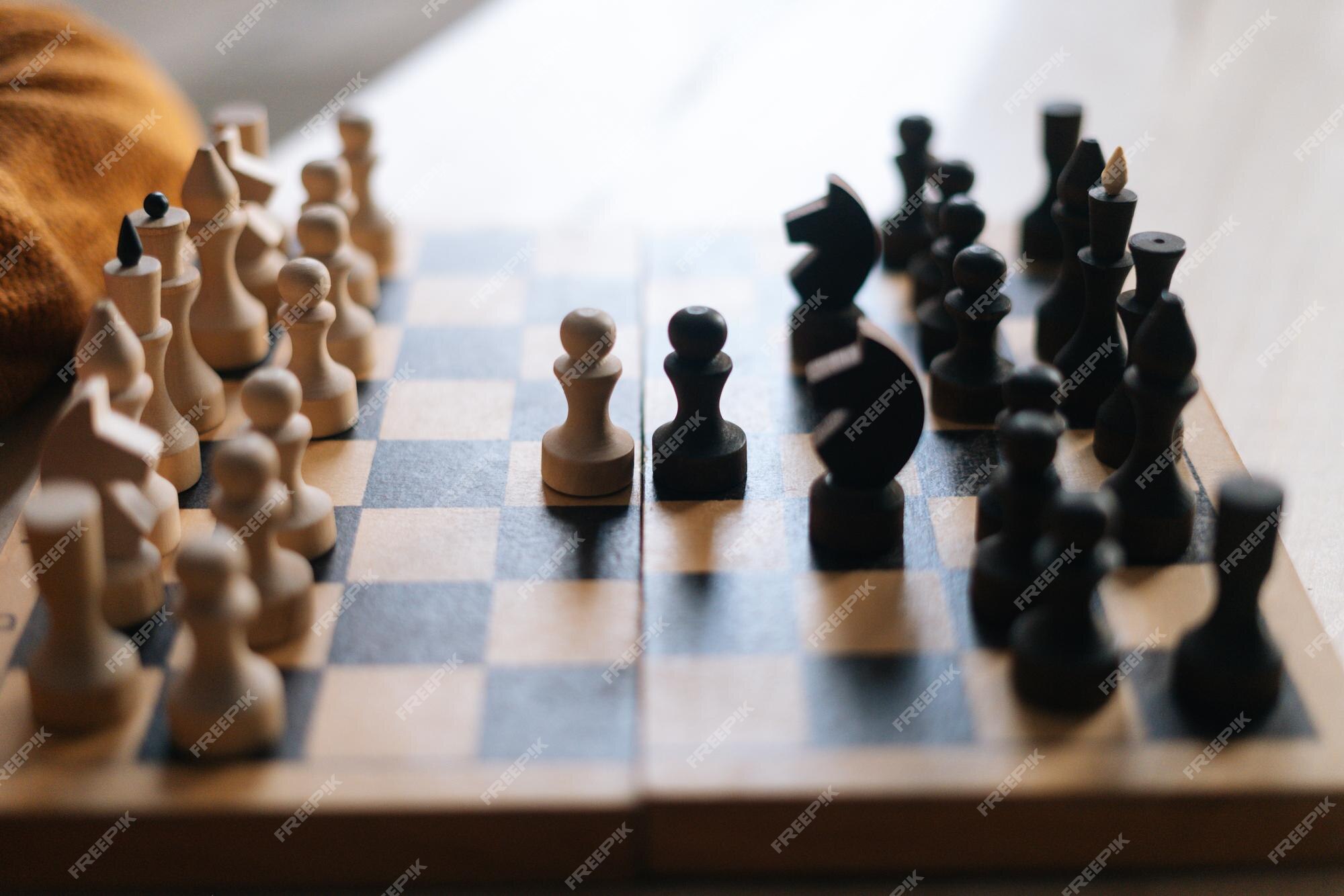 Close-up of chess game and chess pieces on table 4k from Pikwizard