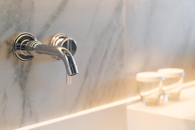 Photo closeup silver tap in luxury bath room