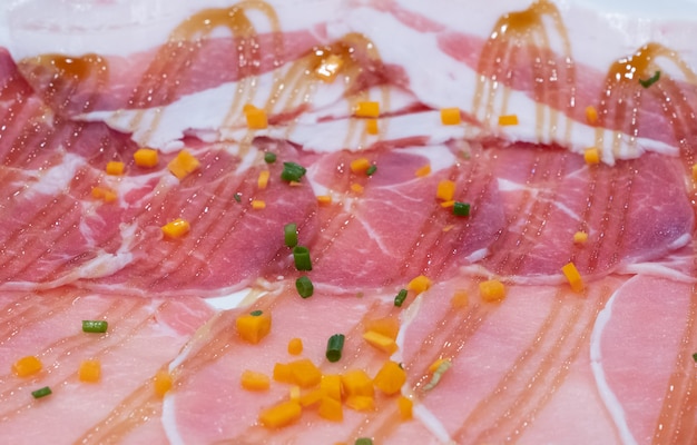 Closeup of the sliced pork with the barbecue sauce.