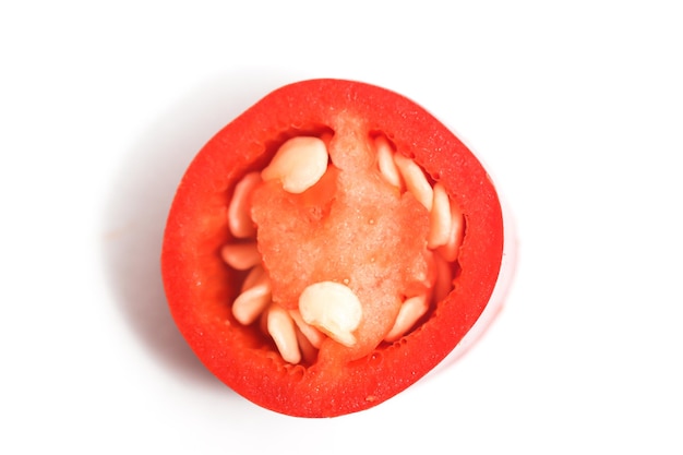Closeup sliced red hot chili pepper top view isolated on white background clipping path