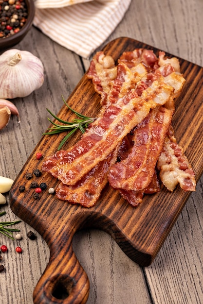 Closeup of slices of crispy hot fried bacon