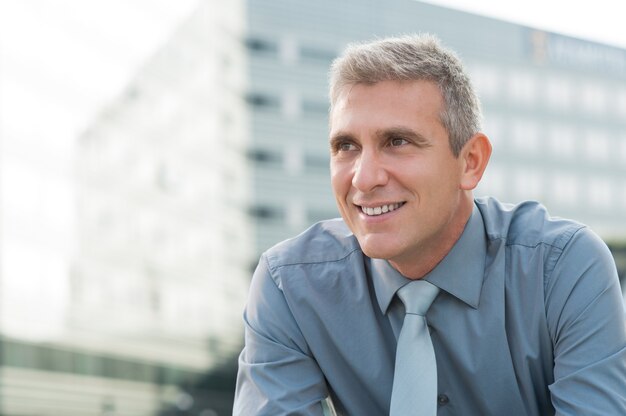 Closeup Of Smiling Mature Businessman Outdoor