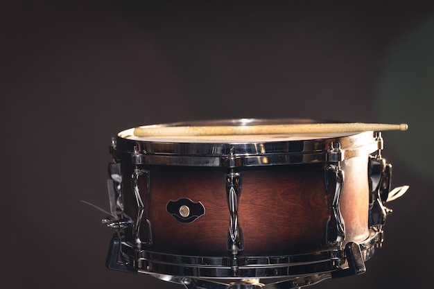 Closeup snare drum on a dark background isolated