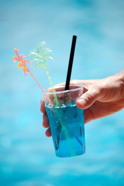 closeup of a soft cocktail on the background of a pond