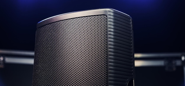 Closeup of a sound speaker against the background of concert lighting