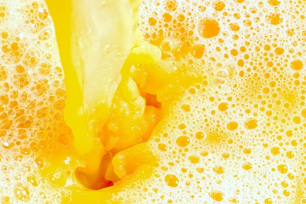 Closeup of splashing orange juice top view Splash of fresh sweet orange mango fruit juice