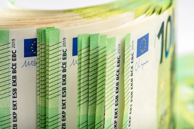 Closeup of a stack of paper bills side view euro banknotes stacked on top of each other big pile of