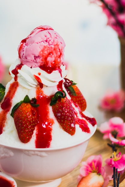 Closeup strawberry Bingsu on tray, Bingsu or Bingsoo, Korean shaved ice dessert with sweet toppings 