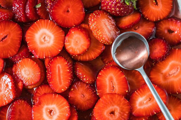 Closeup of strawberry in a saucepan Preparation of strawberry jelly marmalade or sauce