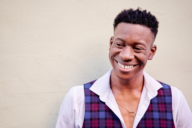 Closeup of a stylish AfricanAmerican man laughing out loud