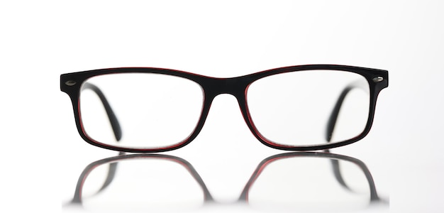 Closeup of stylish eyeglasses with plastic frame optical store advertising Glasses selection or eye test and vision examination at optician concept