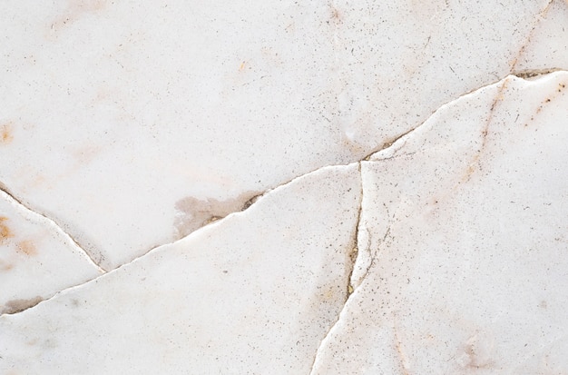 Closeup surface abstract marble pattern at the cracked marble stone floor texture background