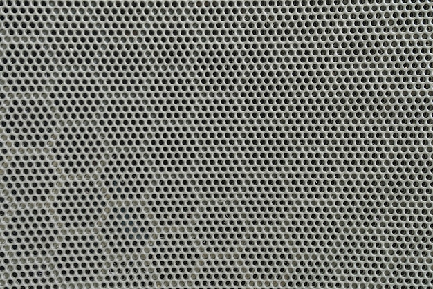 Closeup surface of black metal loudspeaker at the door of car textured background