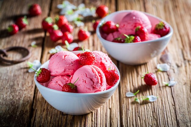 Closeup of tasty ice cream with strawberries and mint leaves