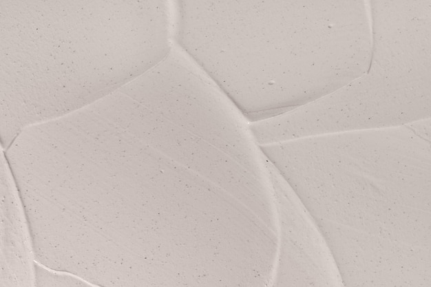 Foto texture closeup di crema idratante beige sfondo del prodotto per la cura della pelle maschera facciale