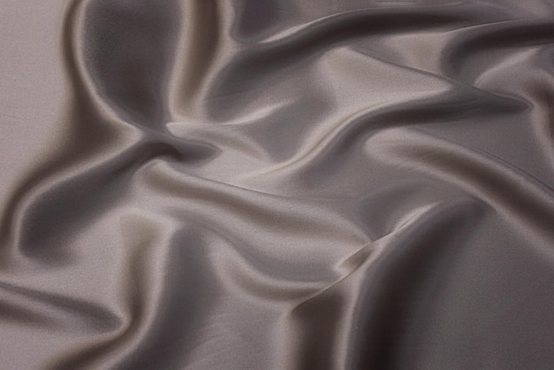 Closeup texture of natural beige fabric or cloth in brown color