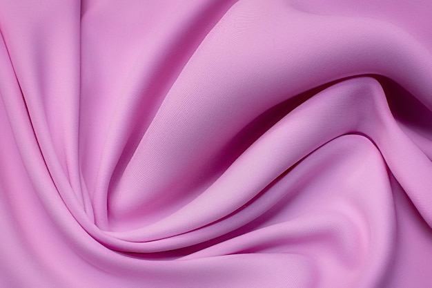 Closeup texture of natural red or fuchsia fabric or cloth in same color