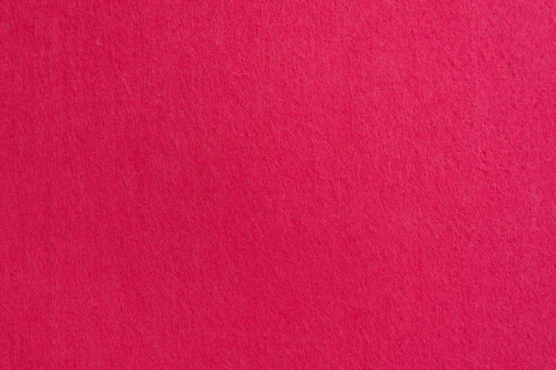 Текстура крупным планом из натуральной алой или розовой ткани Ткань в качестве фона Яркий материал для дизайна