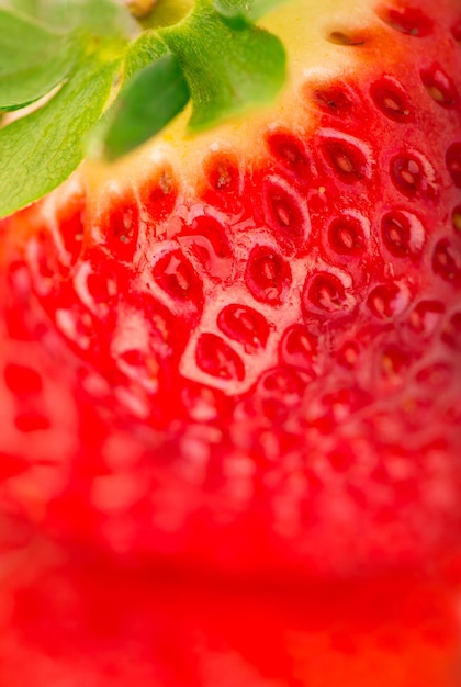 Struttura del primo piano della priorità bassa di immagine macro della fragola