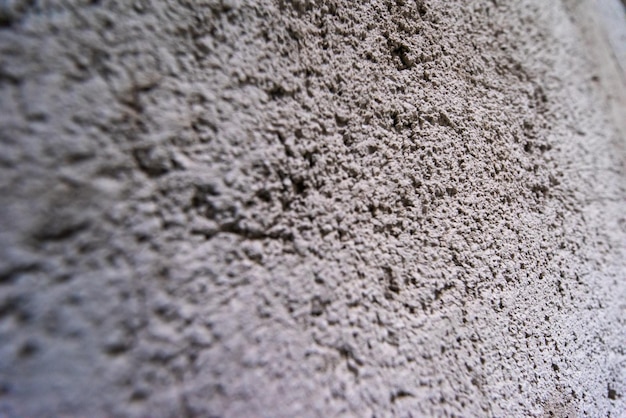 Photo closeup of textured grey concrete wall