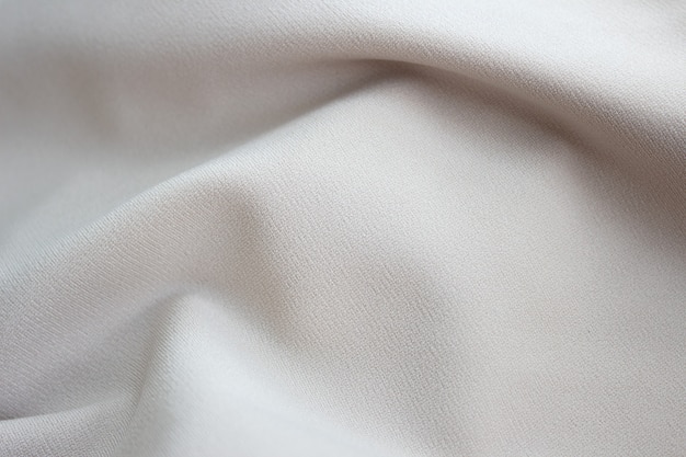 Closeup textuur van beige stof of doek in beige kleur stof textuur van beige achtergrond verfrommeld